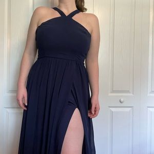 Oxford blue long sleeveless dress with leg slit on left side.